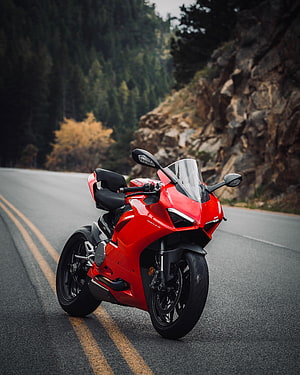Red Ducati Panigale V2 Sportbike Parked on a Winding Mountain Road HD phone wallpaper