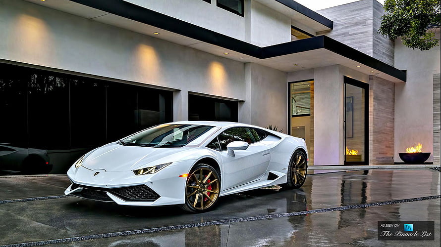 White Lamborghini Huracan with Gold Wheels Parked in Front of Modern Luxury Residence HD wallpaper