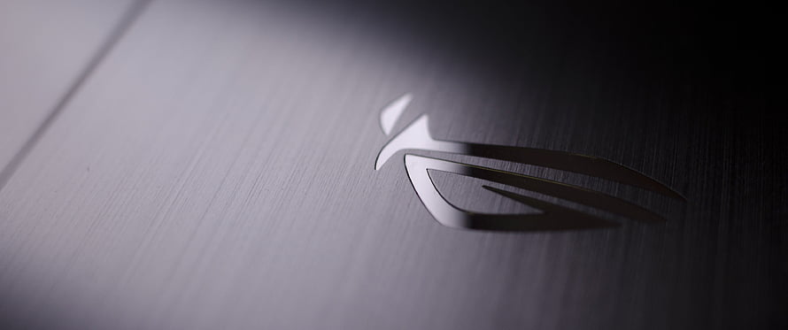 Asus Republic of Gamers Logo on Brushed Metal Surface HD wallpaper