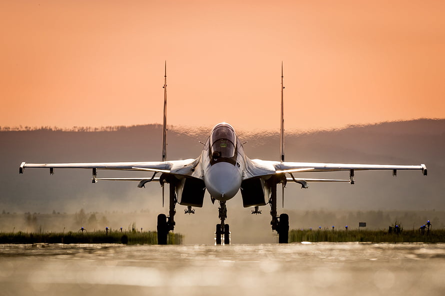 Sukhoi Su-30 Fighter Jet Landing on Runway at Golden Hour HD wallpaper