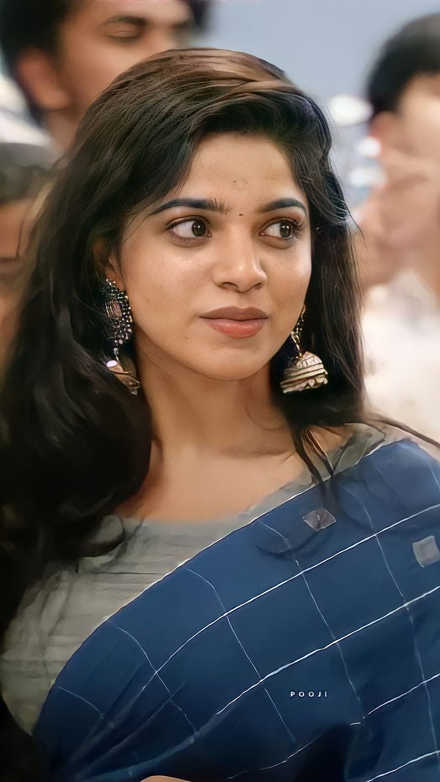 Nayanthara in a blue saree with traditional earrings and a gentle smile HD phone wallpaper