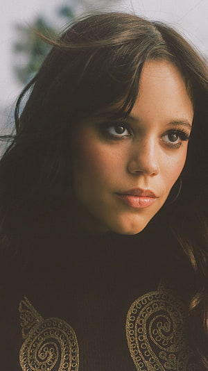 Portrait of a woman with dark hair and gold embroidery, Jenna Ortega, hollywood actress, model HD phone wallpaper