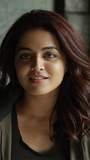 Wamiqa Gabbi Portrait in Olive Jacket with Dark Wavy Hair HD phone wallpaper