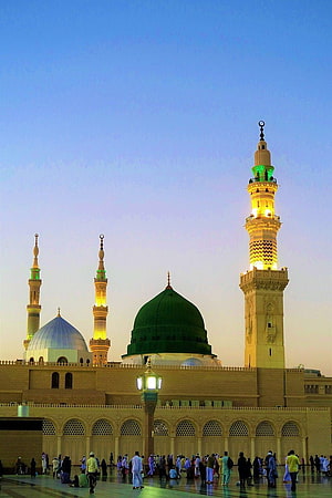 Prophet's Mosque in Medina at Dusk with Illuminated Minarets and Green Dome HD phone wallpaper