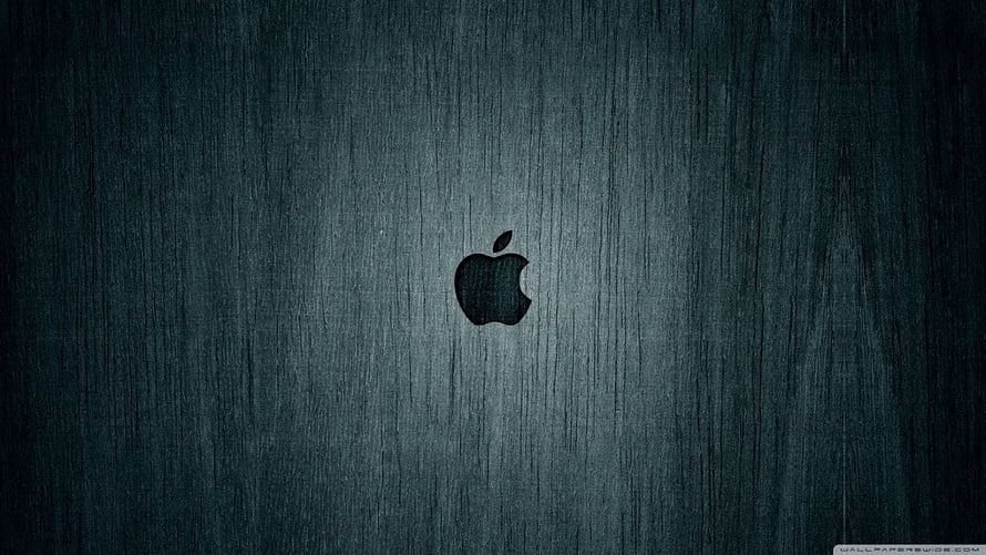 Apple Logo on Dark Brushed Metal Surface with Subtle Lighting Gradient HD wallpaper