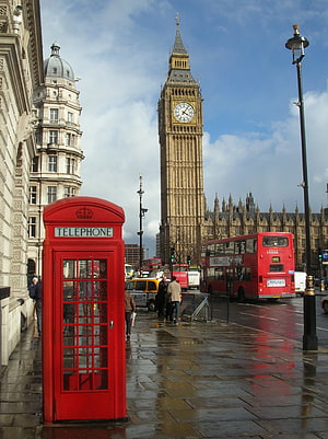 Classic London Street Scene Featuring Big Ben, Red Telephone Box, and Double-Decker Bus on a Rainy Day HD phone wallpaper