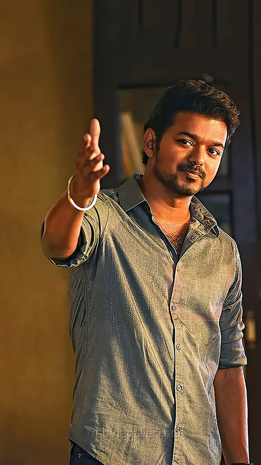 Vijay Thalapathy in a Dramatic Pose Wearing a Grey Button-Down Shirt HD phone wallpaper
