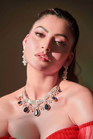 Urvashi Rautela in a stunning red off-shoulder gown with diamond and sapphire jewelry HD phone wallpaper