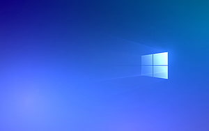 Windows 10 Default Blue Gradient Wallpaper with Glowing Window Logo HD wallpaper