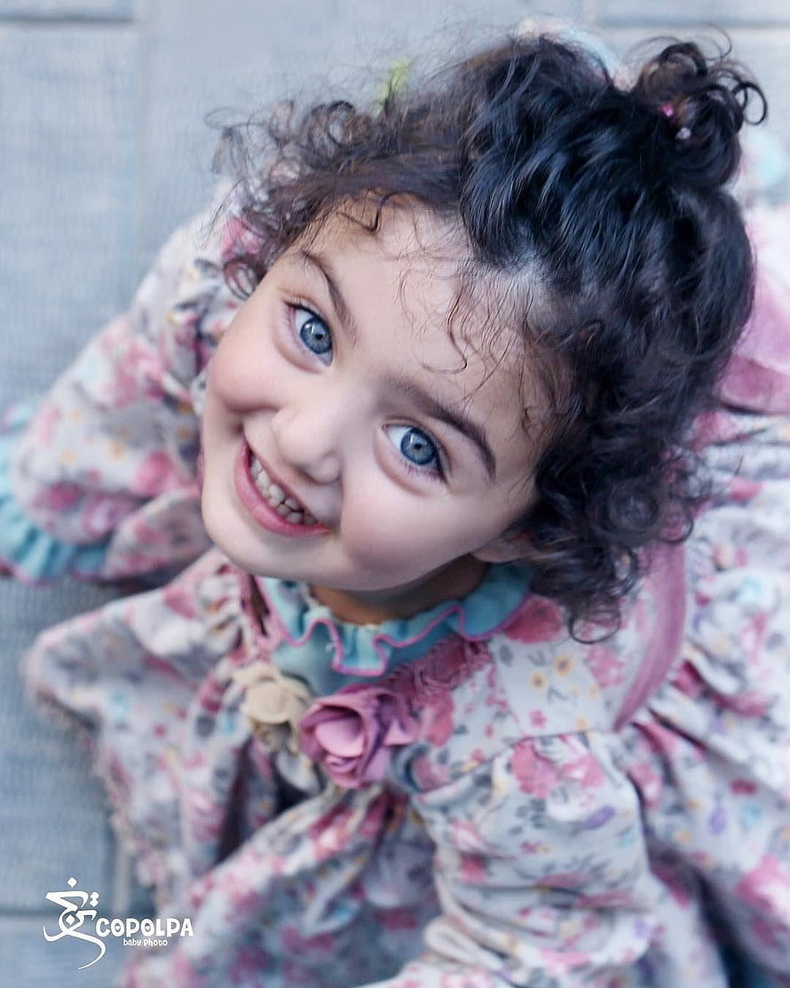 Anahita Hashemzadeh Smiling Portrait in Floral Dress with Curly Hair HD phone wallpaper