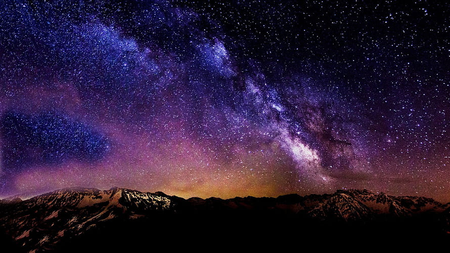 Milky Way Galaxy Arching Over Snow-Capped Mountain Ranges at Night HD wallpaper
