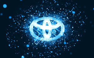 Glowing Toyota Emblem With Electric Blue Particles And Neon Energy Burst HD wallpaper