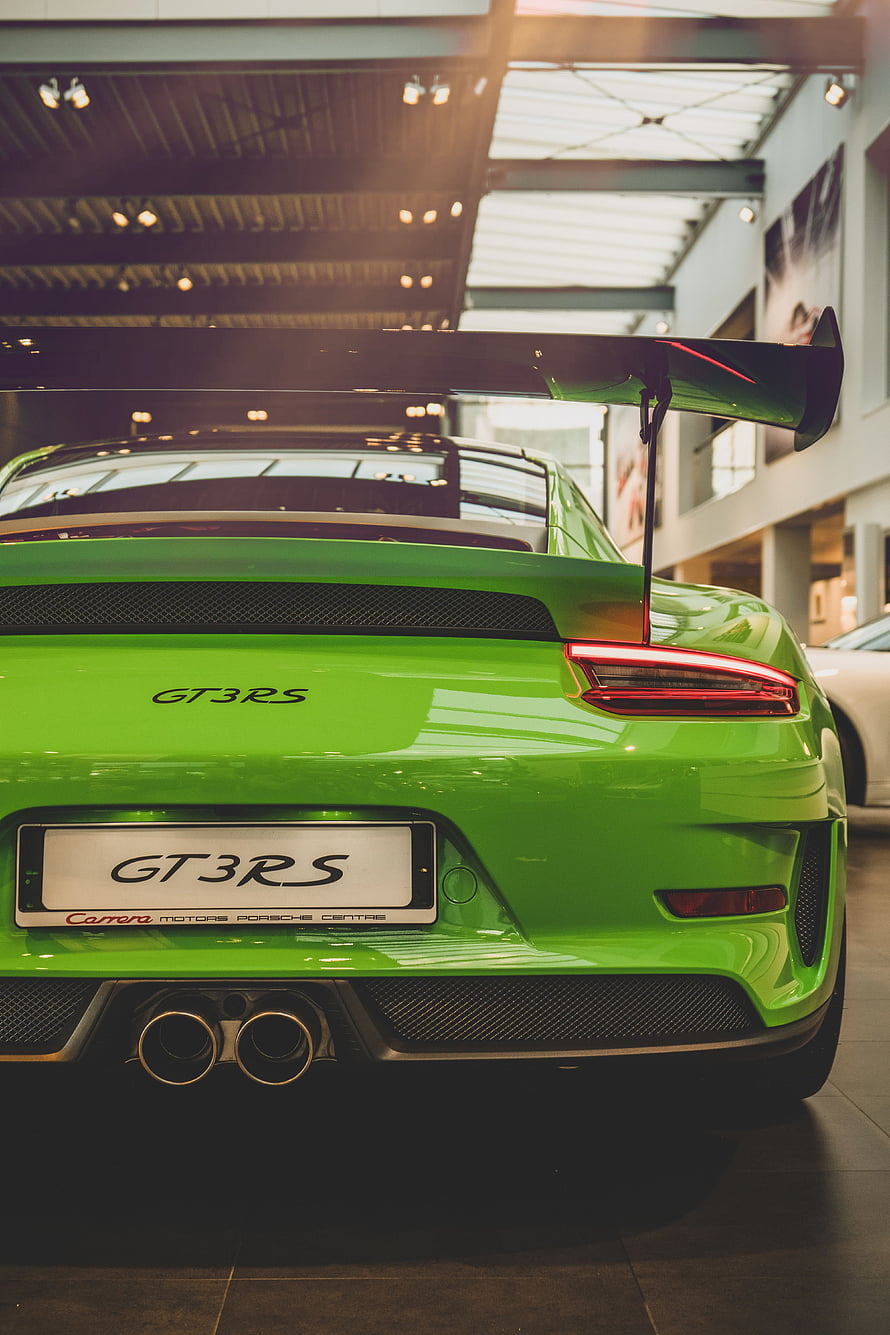 Rear View of Lime Green Porsche 911 GT3 RS with Large Carbon Fiber Spoiler HD phone wallpaper