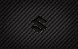 Sleek Black Suzuki Logo on Dark Carbon Fiber Texture Background HD wallpaper
