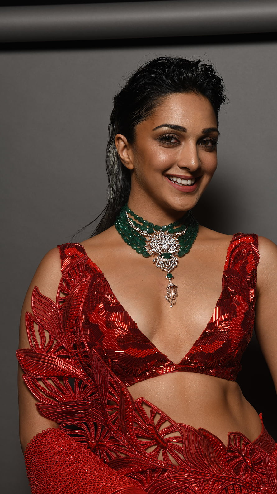 Kiara Advani in a stunning red sequined lehenga with an emerald necklace HD phone wallpaper