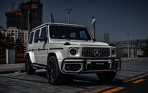 Silver Mercedes-AMG G63 SUV with Black Bull Bar and Urban City Background HD wallpaper
