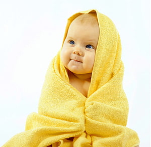 Adorable Baby Boy Wrapped in a Soft Yellow Hooded Towel HD wallpaper