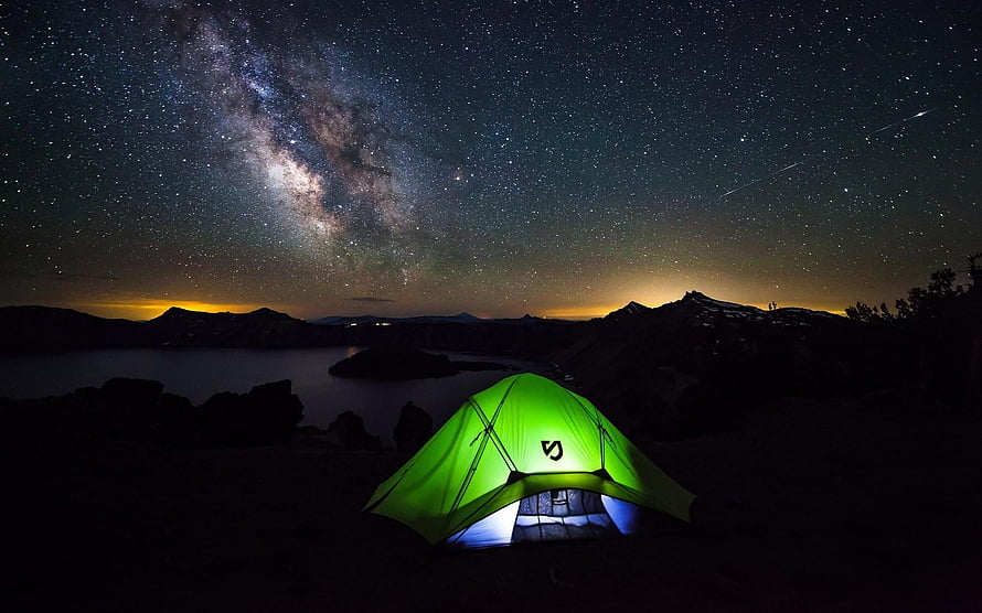Glowing Green Tent Under the Milky Way Over a Mountain Lake at Night HD wallpaper