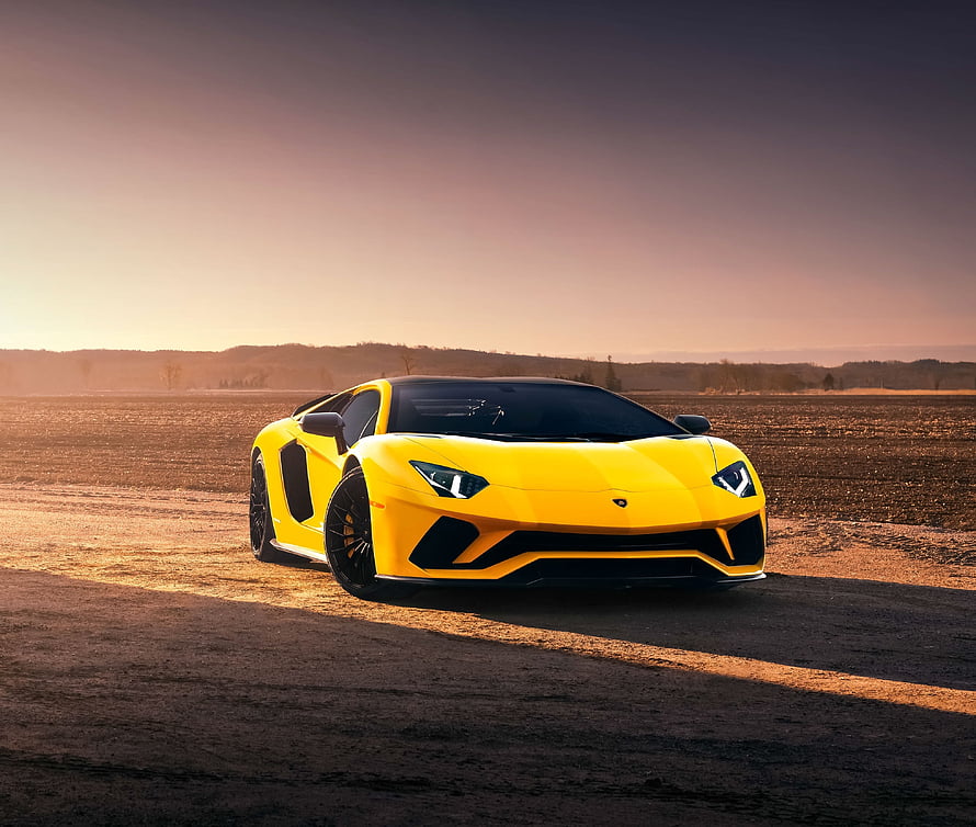 Yellow Lamborghini Aventador S Super Car on an Open Road at Sunset HD wallpaper