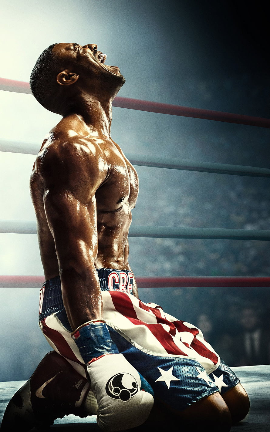 Adonis Creed kneeling in the ring with American flag trunks and boxing gloves HD phone wallpaper