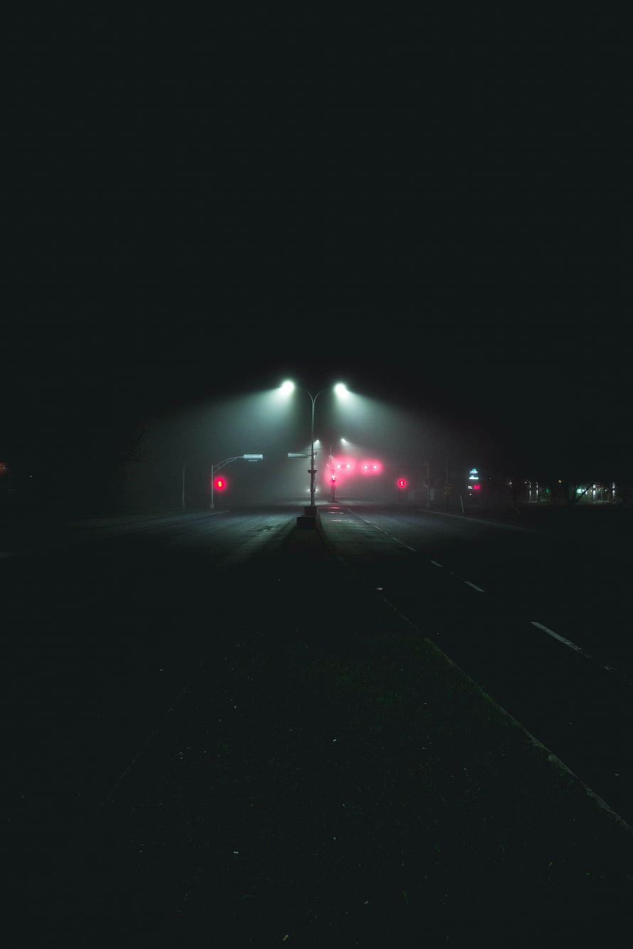 Empty City Road at Night with Glowing Streetlights and Red Traffic Signals in Fog HD phone wallpaper
