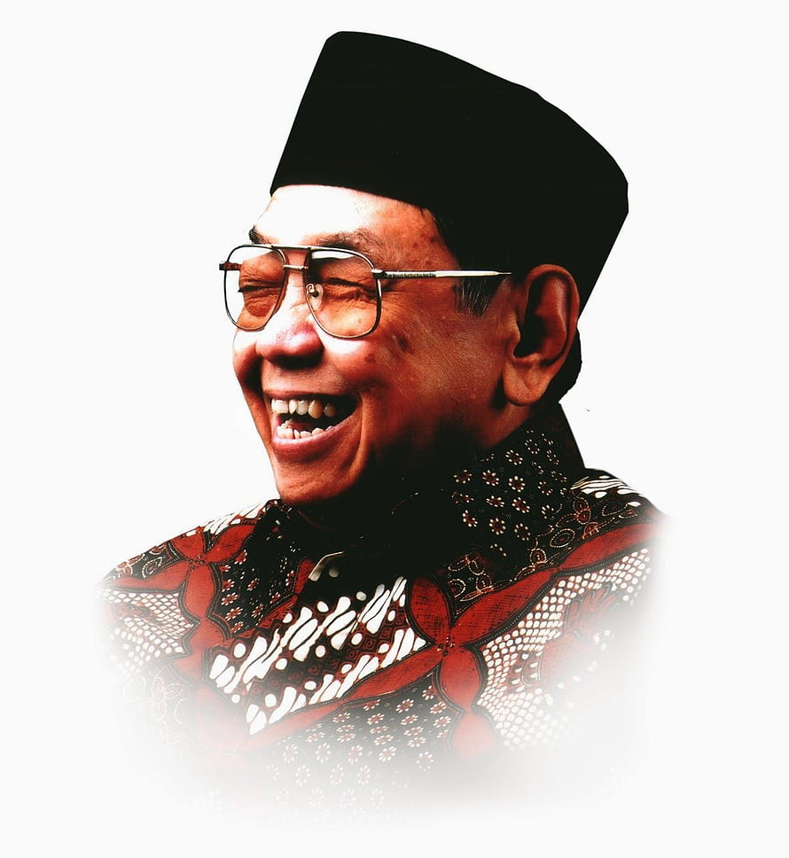 Gus Dur smiling portrait wearing traditional batik shirt and black peci hat HD phone wallpaper