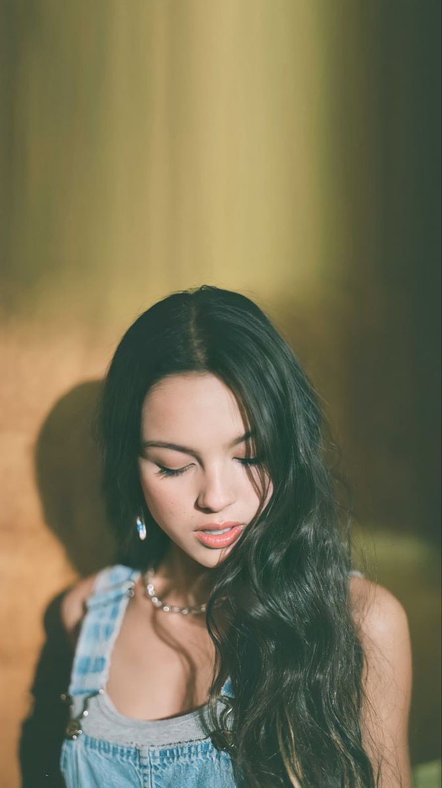 Olivia Rodrigo in Denim Overalls with Soft Golden Hour Lighting HD phone wallpaper