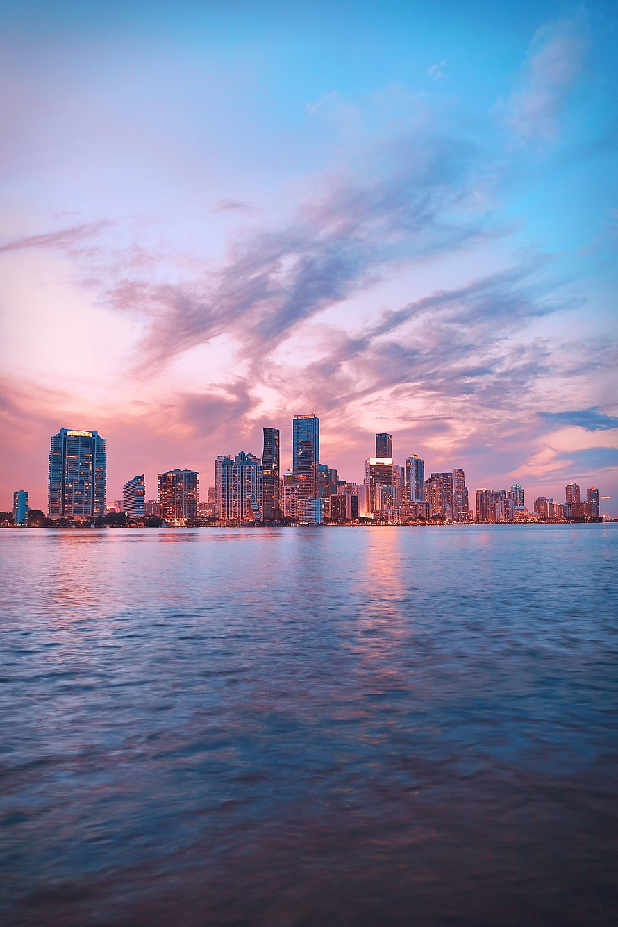 Miami Skyline at Dusk with Pink and Blue Clouds Reflecting on the Water HD phone wallpaper