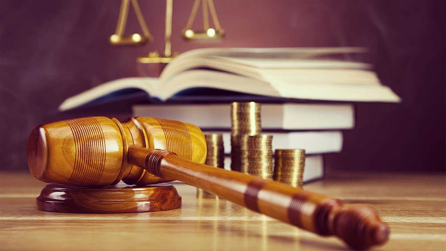Legal Justice Concept with Gavel, Coins, and Law Books on Wooden Desk HD wallpaper