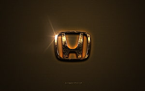 Glowing Honda Emblem on Textured Brown Metal Surface with Warm Golden Light HD wallpaper