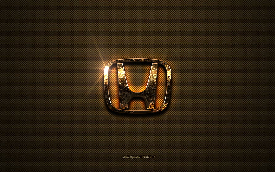 Glowing Honda Emblem on Textured Brown Metal Surface with Warm Golden Light HD wallpaper