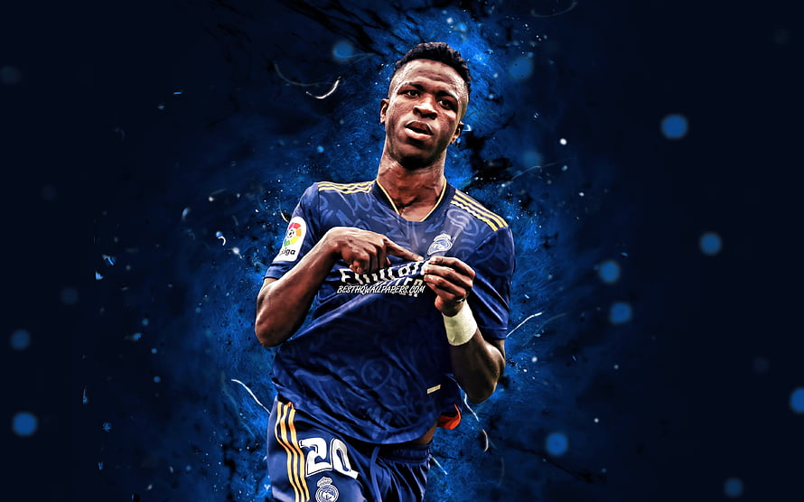 Vinicius Junior in Real Madrid Kit with Dynamic Blue Ink Splash Background HD wallpaper