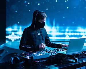Alan Walker DJ Setup with Mixer and Laptop in Blue Neon Studio HD wallpaper