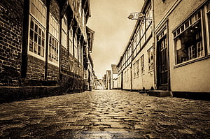 Historic Cobblestone Lane in Ribe Old Town with Traditional Danish Architecture HD wallpaper