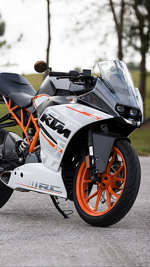KTM RC 390 Sport Motorcycle in White and Orange Parked on Asphalt Road HD phone wallpaper