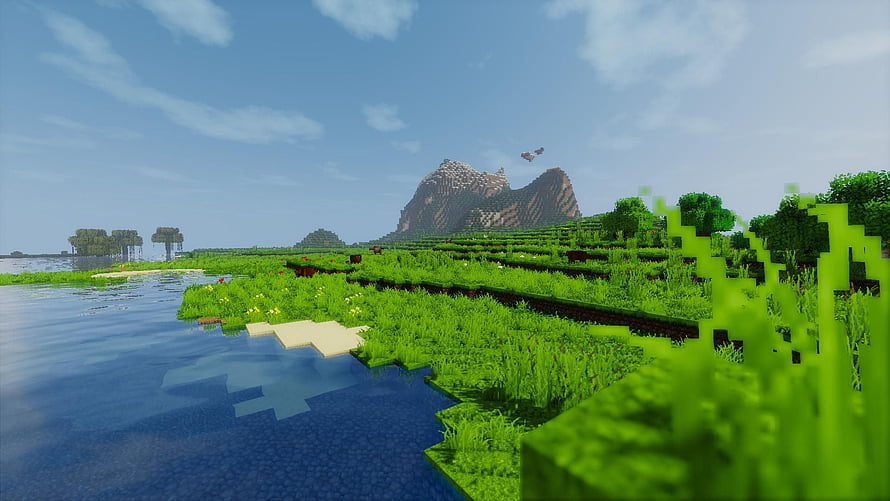 Minecraft Plains Biome Landscape with Water and Distant Mountains HD wallpaper