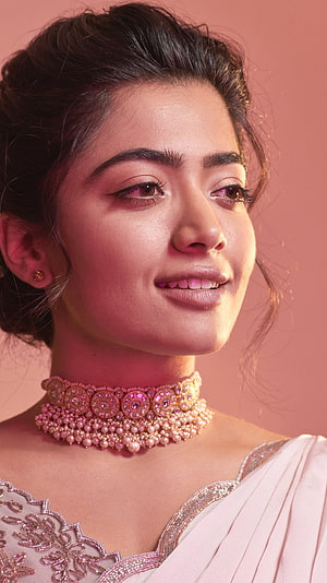 Portrait of a woman in a white saree with a pearl choker necklace, Rashmika mandanna r, rashmika mandanna HD phone wallpaper