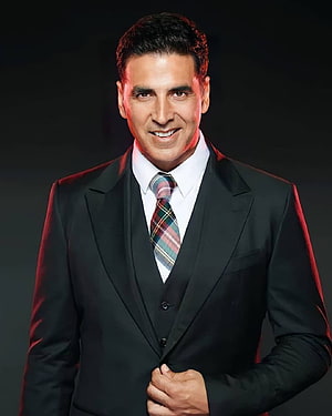 Akshay Kumar in a Formal Black Three-Piece Suit with Plaid Tie HD phone wallpaper