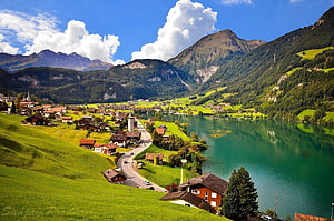 Alpine Village and Turquoise Lake in the Swiss Mountains HD wallpaper