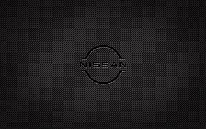Nissan emblem on dark carbon fiber texture with subtle diagonal weave pattern HD wallpaper