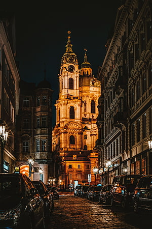 Illuminated St Nicholas Church in Prague Old Town at Night HD phone wallpaper