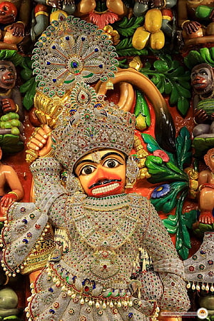 Kasturbhanjan Dev Murti with Intricate Gemstone Adornments and Traditional Temple Carvings HD phone wallpaper