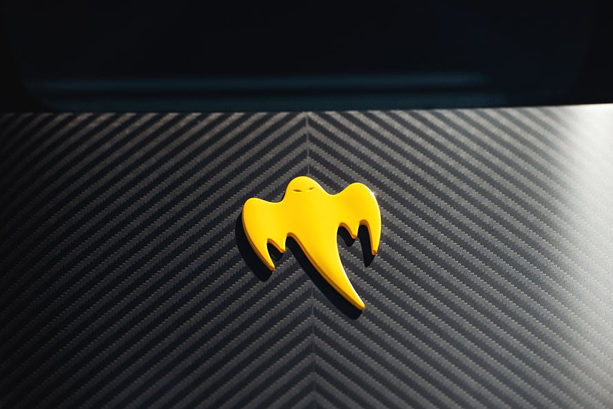Koenigsegg Ghost Emblem on Carbon Fiber Surface HD wallpaper