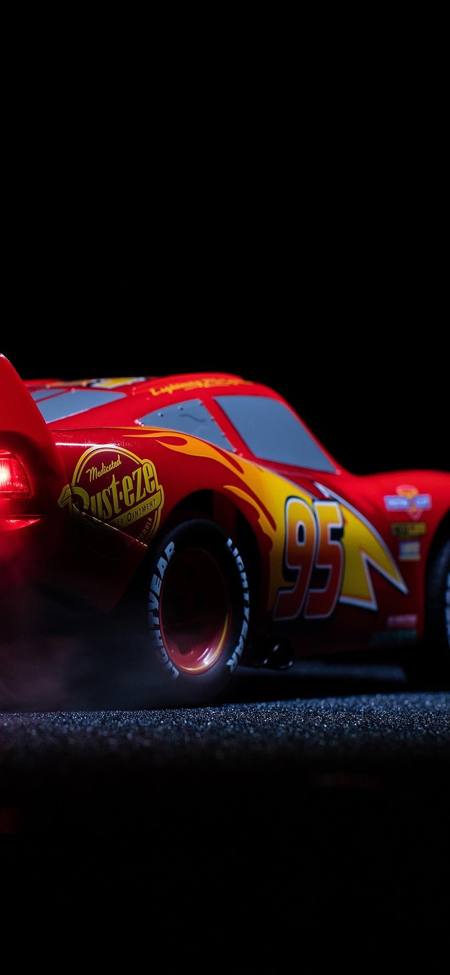 Lightning McQueen Number 95 Red Race Car Model on Dark Asphalt HD phone wallpaper