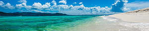 Panoramic View of Turquoise Ocean Waves Crashing on White Sandy Beach with Blue Sky HD wallpaper