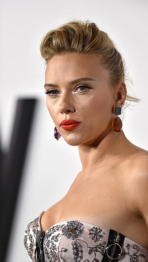 Scarlett Johansson in an elegant strapless gown with bold red lipstick and statement earrings HD phone wallpaper