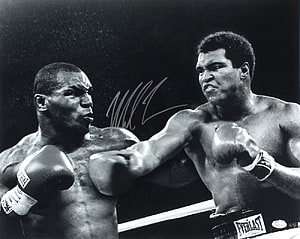Muhammad Ali and Mike Tyson in a dramatic black and white boxing confrontation HD wallpaper