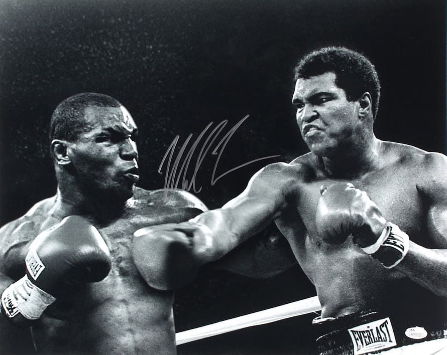 Muhammad Ali and Mike Tyson in a dramatic black and white boxing confrontation HD wallpaper
