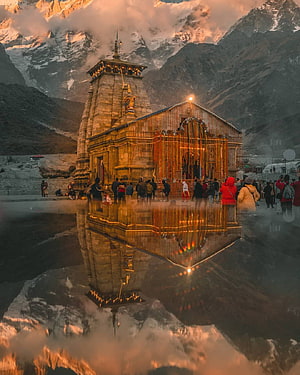 Kedarnath Temple at Golden Hour with Snow-Capped Himalayan Peaks and Water Reflection HD phone wallpaper