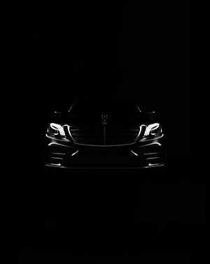 Mercedes-Benz Front Fascia with Illuminated Headlights Against Black Background HD phone wallpaper